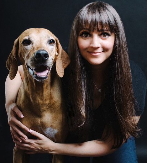 woman holding a dog