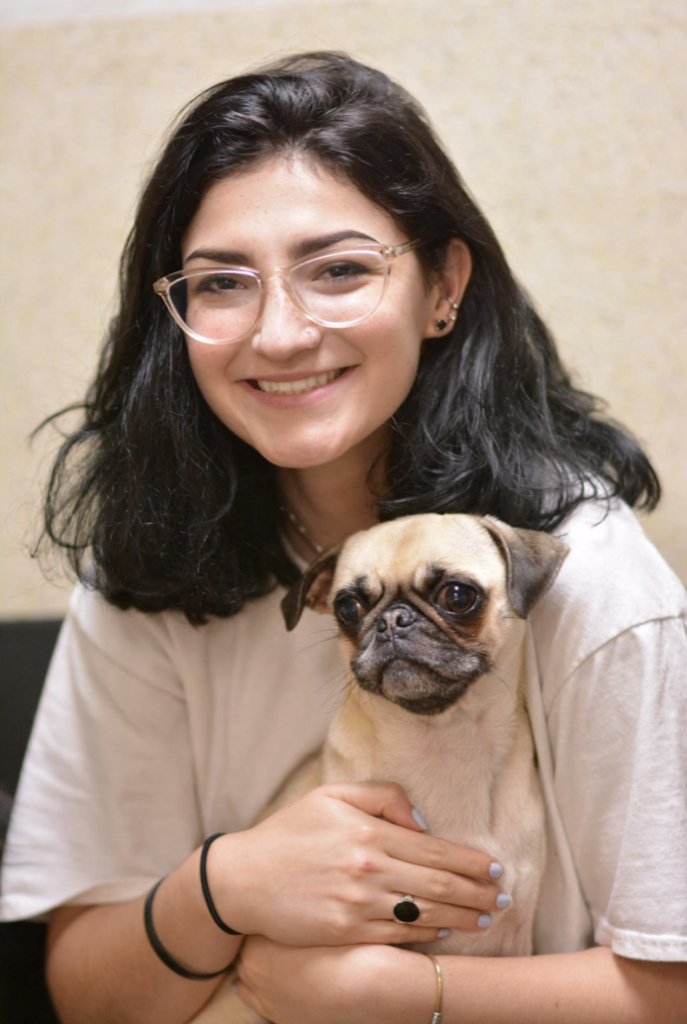 Woman holding a pug